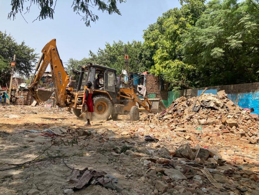 bulldozer action on slum