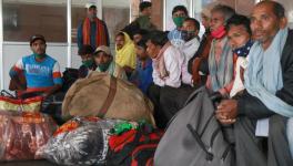 Non local laborers waiting for train inside railwaysation Nowgam